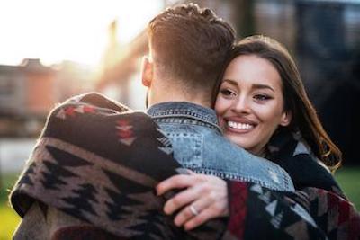 A couple hugging after teeth whitening in Neutral Bay, NSW.