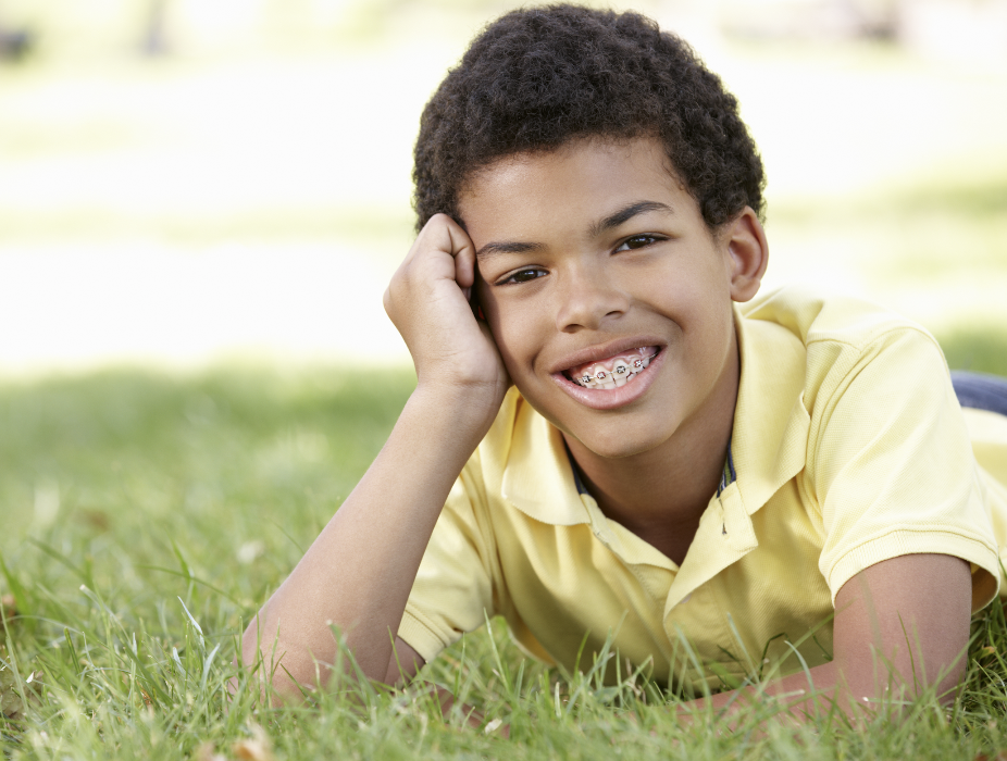 Boy smiling with Braces from Sparkling Dental