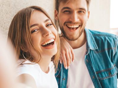Couple smiling after teeth whitening in Neutral Bay, NSW.