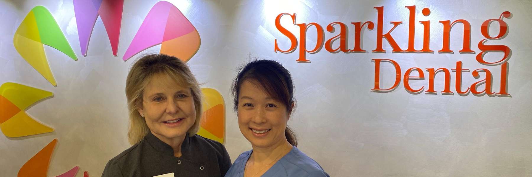 A picture containing Sparkling Dental and two staff members in Neutral Bay, NSW.