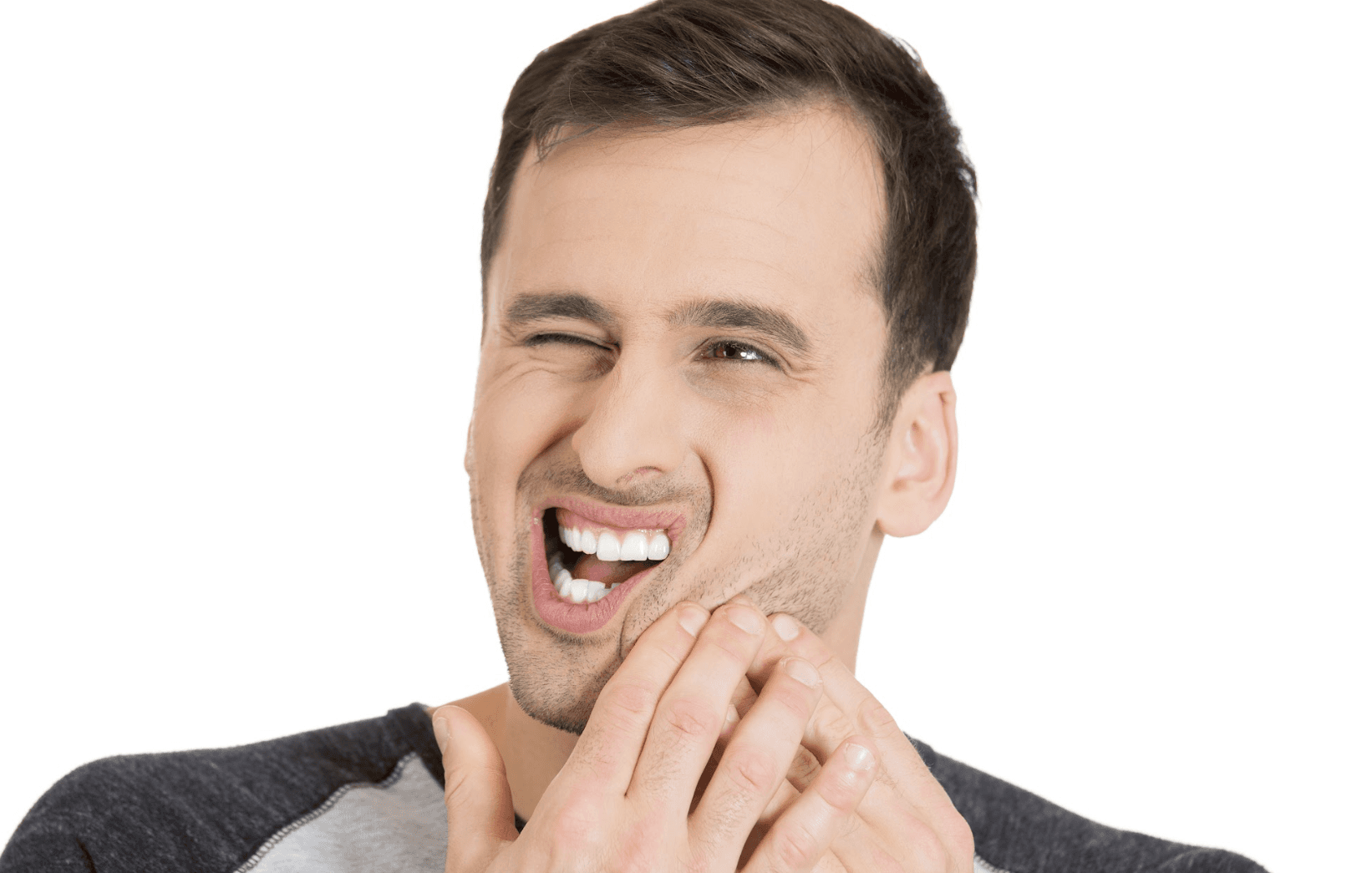 A male patient holding his jaws with a toothache at Sparkling Dental