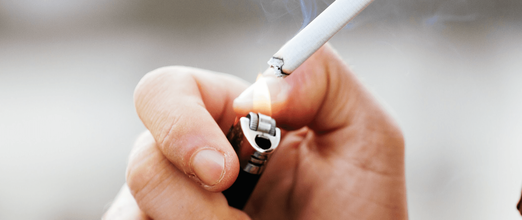 Photo of a hand lighting a cigarette in Neutral Bay, NSW