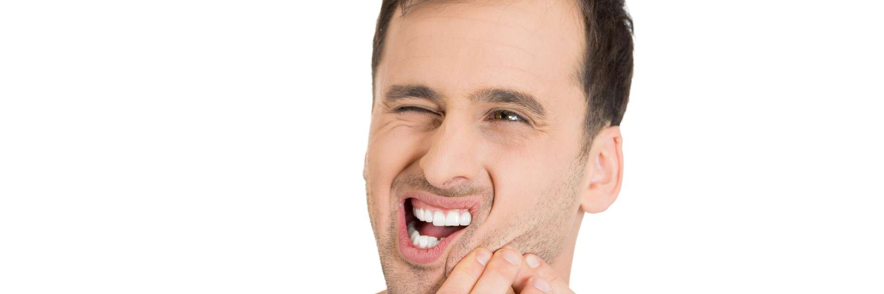 Man holding his jaw due to a dental emergency in Neutral Bay, NSW
