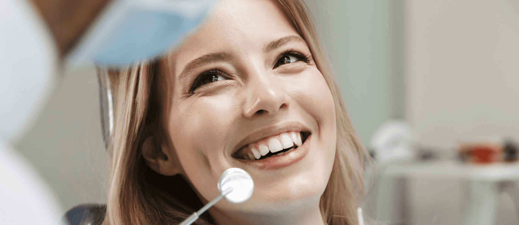 Patient smiling during dental check up ad examination in in Neutral Bay, NSW