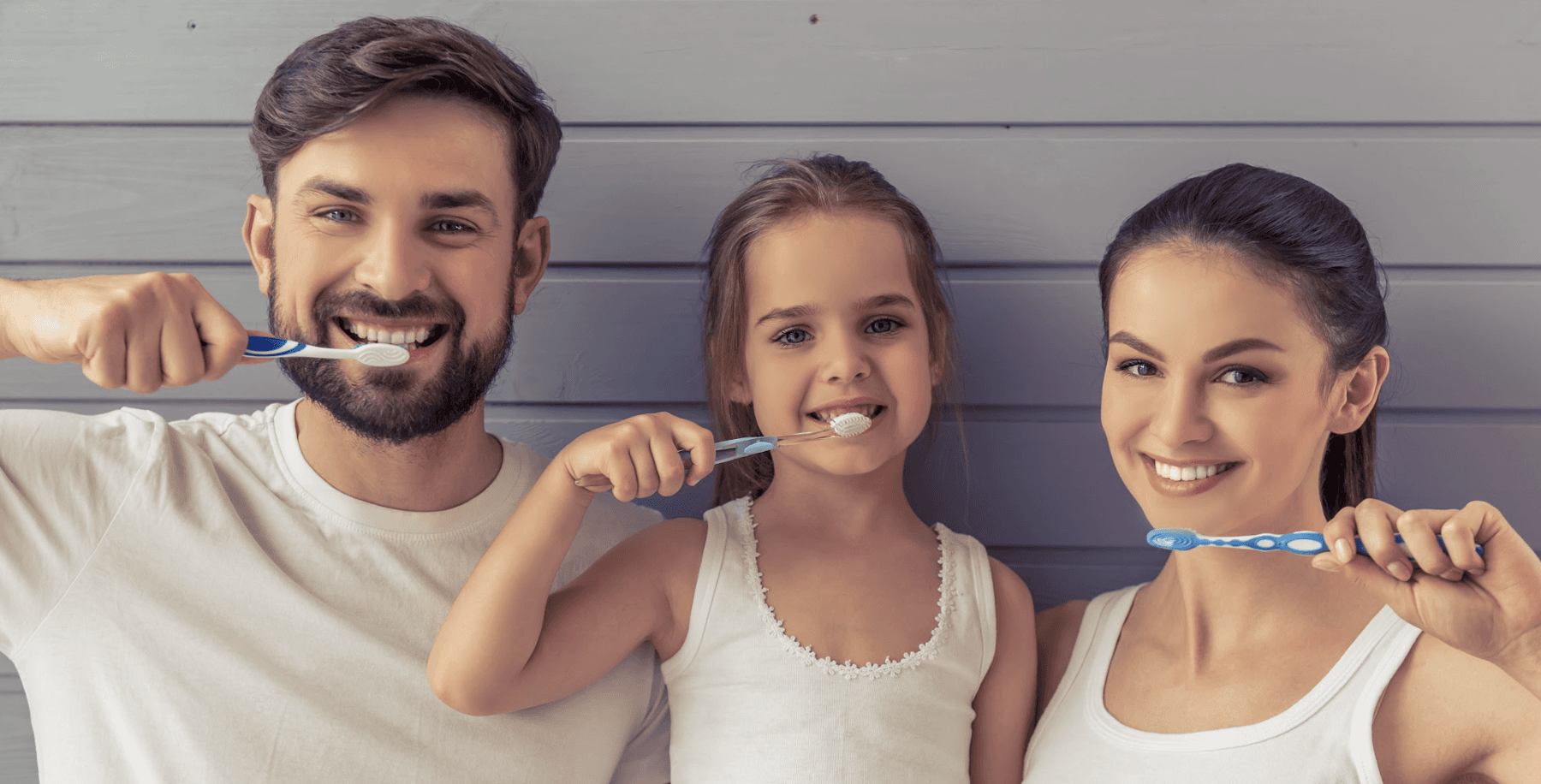 Family of three brushing their teeth in Neutral Bay, NSW