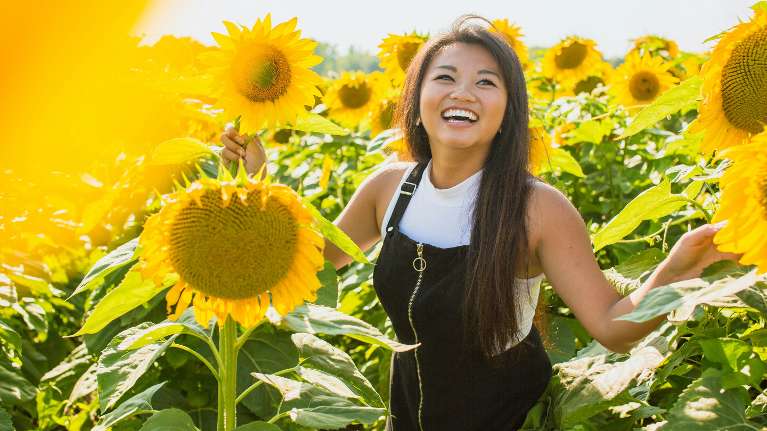 A woman smiling after a teeth whitening treatment in Neutral Bay
