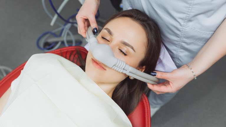 Lady relaxing during sedation dentistry at Sparkling Dental