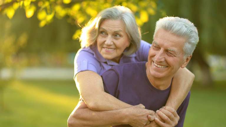 Couple playing after dental emergency treatment at Sparkling Dental