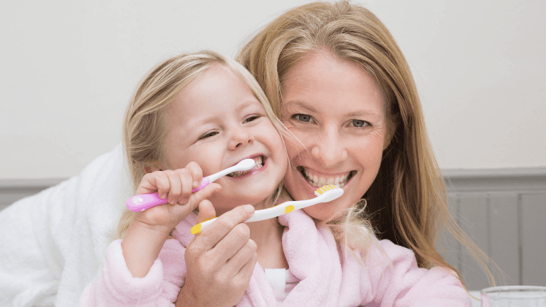 Mother and daughter brushing their teeth in Neutral Bay, NSW