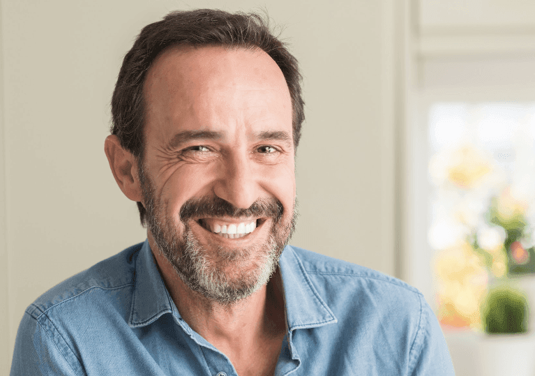 an middle aged man with Dental Crowns in Neutral Bay