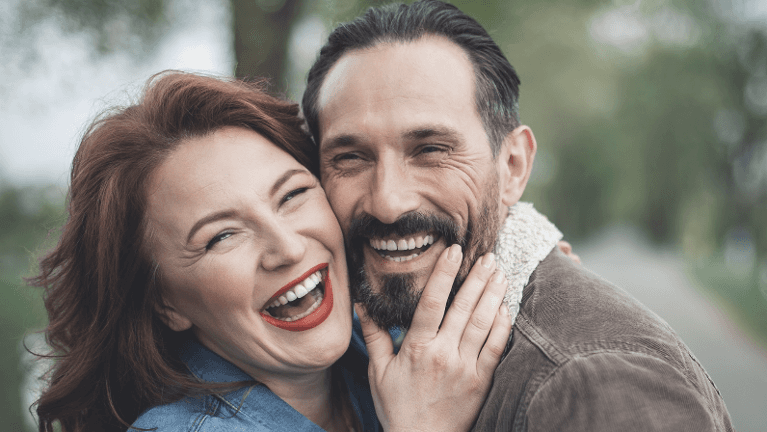 Happy couple laughing after general dentistry in Neutral Bay, NSW