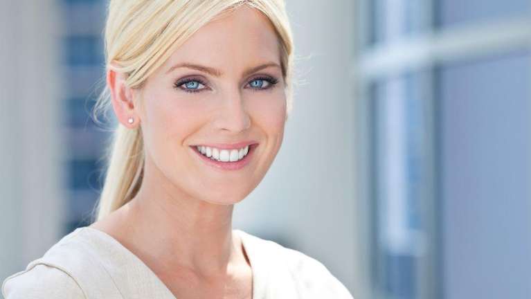Woman Smiling after getting veneers in Neutral Bay, NSW
