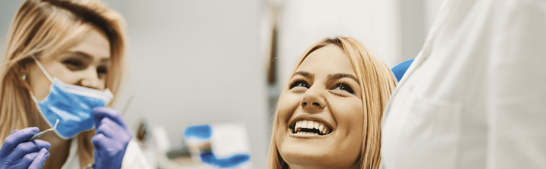 A woman smiling after a Dental Care in Neutral Bay, NSW
