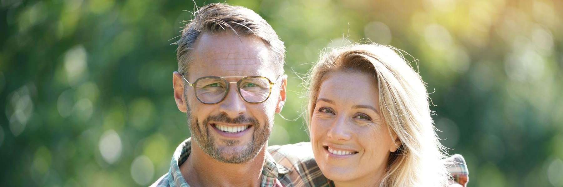 Couple Smiling after getting veneers at Sparkling Dental 