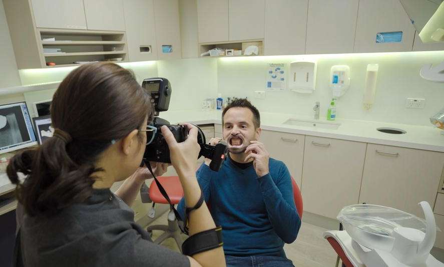 Dentist taking a photo of patient's teeth in Neutral Bay, NSW