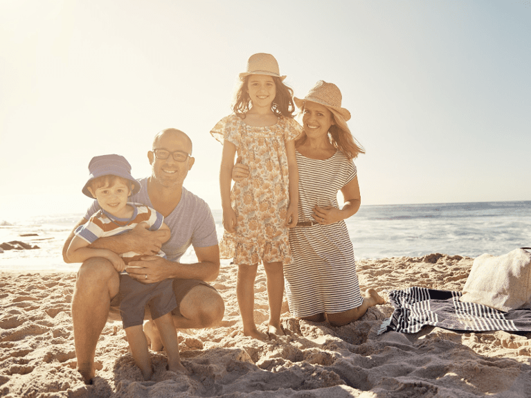 Family pose for a photo after general dentistry at Sparkling Dental