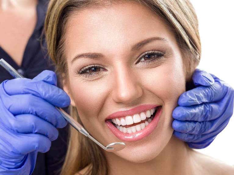 A lady undergoing teeth whitening at Sparkling Dental in Neutral Bay, NSW.